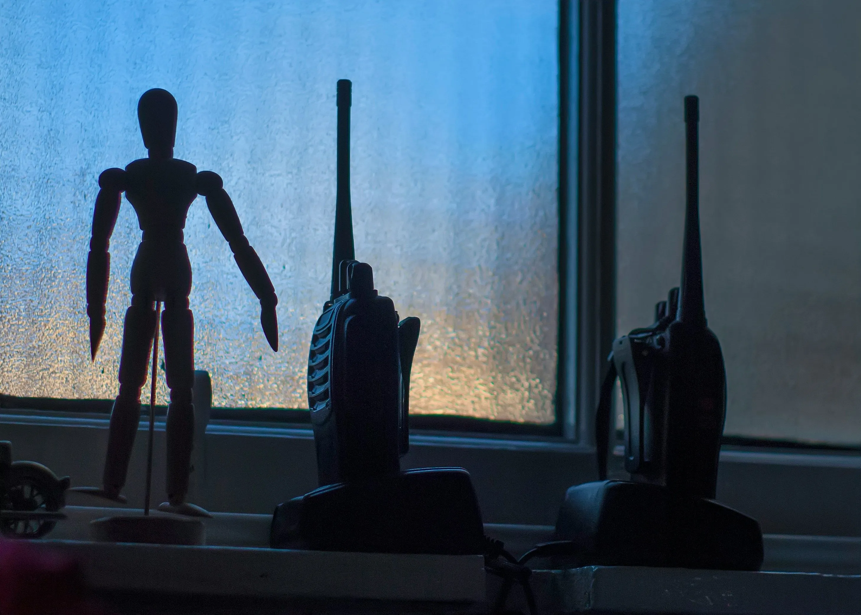 Remote public safety radio tower site with industrial IoT sensors monitoring power, fuel, and environmental conditions for critical police communications network