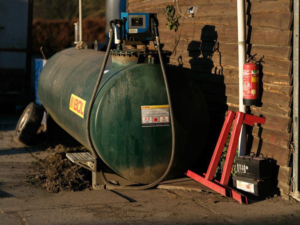 Industrial diesel fuel storage tank with wireless IoT level sensor monitoring fuel levels in real time